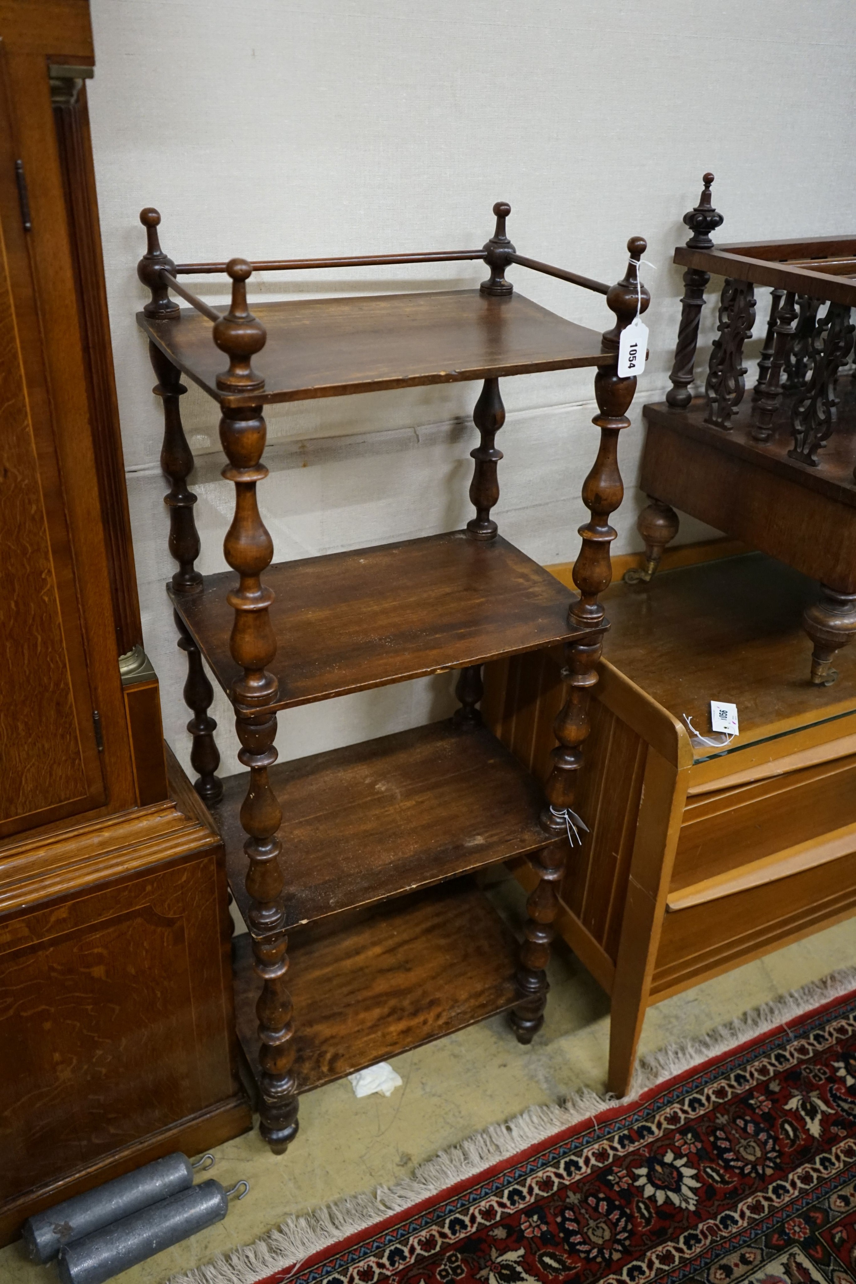 A Victorian mahogany walnut four-tier whatnot, (severely wormed) width 44cm, depth 30cm, height 118cm